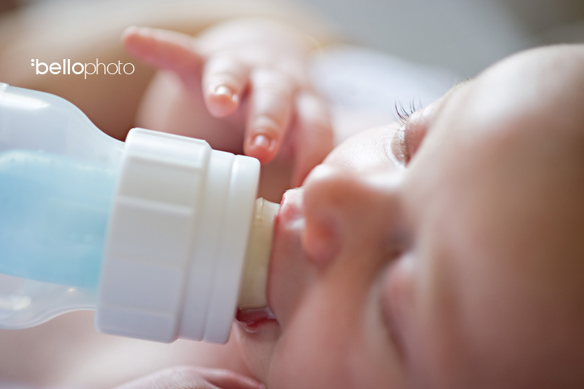 baby feeding on bottle