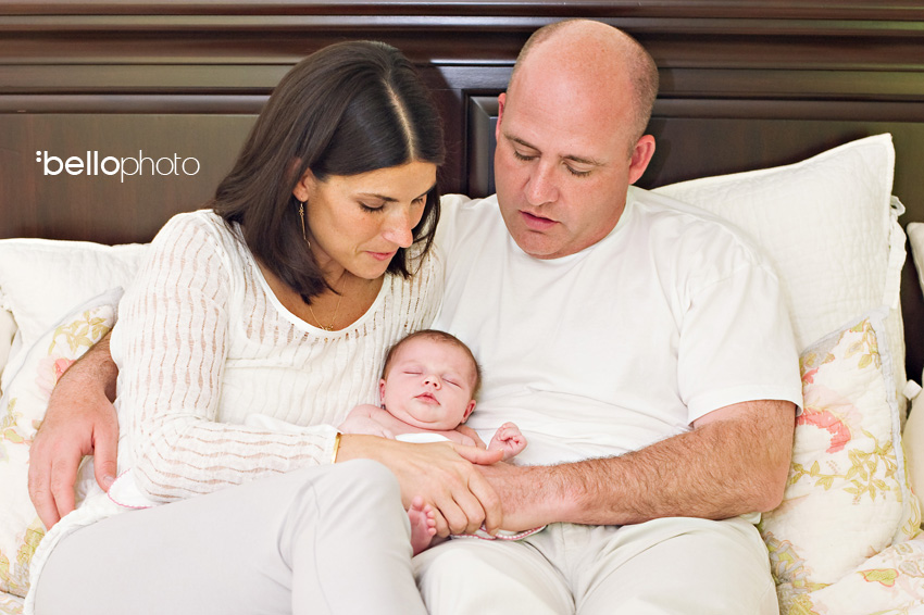 parents with sleeping baby
