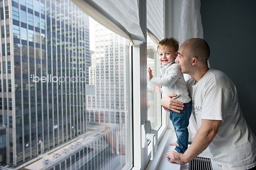 dad & toddler in window of NYC apartment, lifestyle photographers