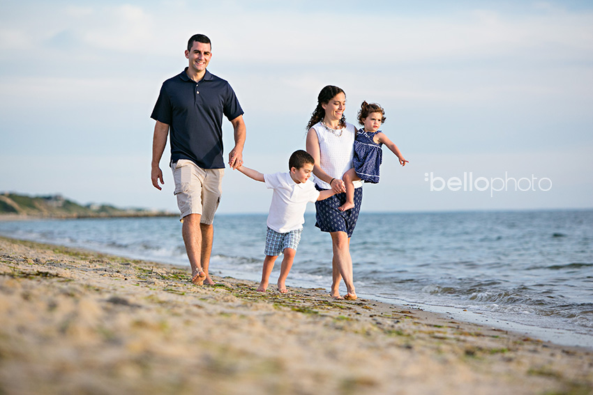 family walking along shore