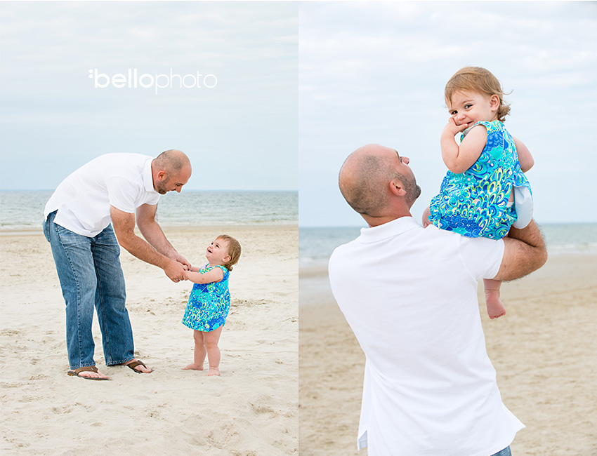 father playing with daughter at beach