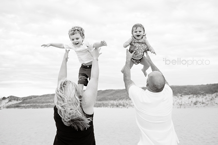 parents throwing kids up in air