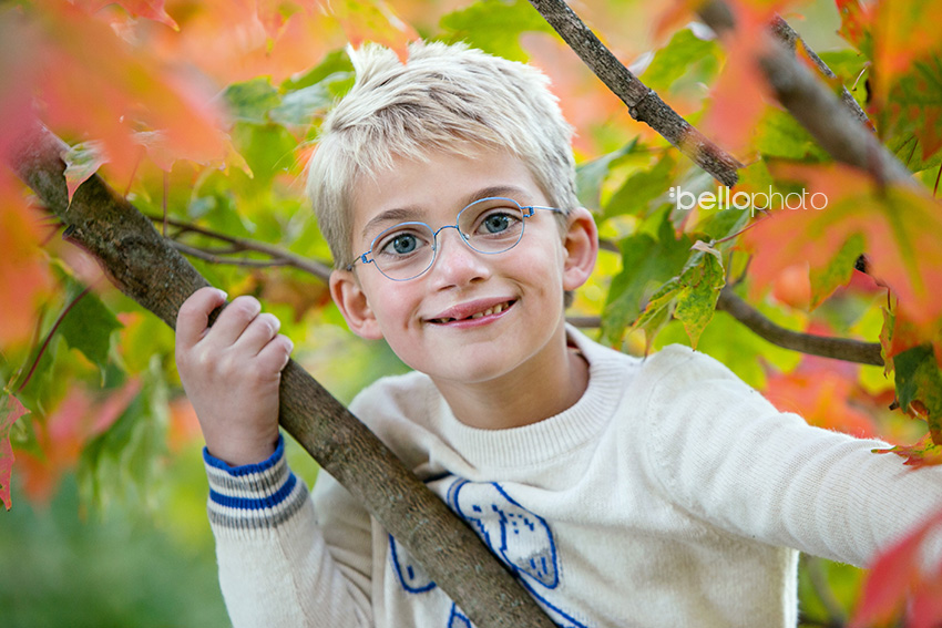 boy in changing leaves