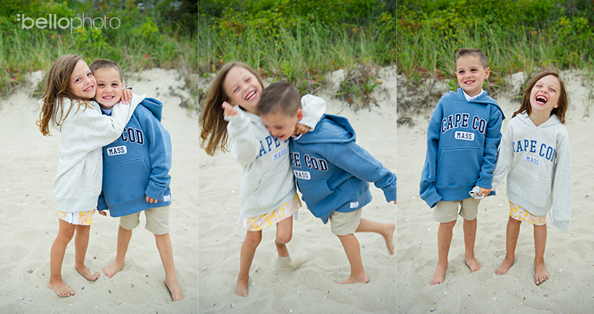 adorable twins in matching cape cod sweatshirts at the beach