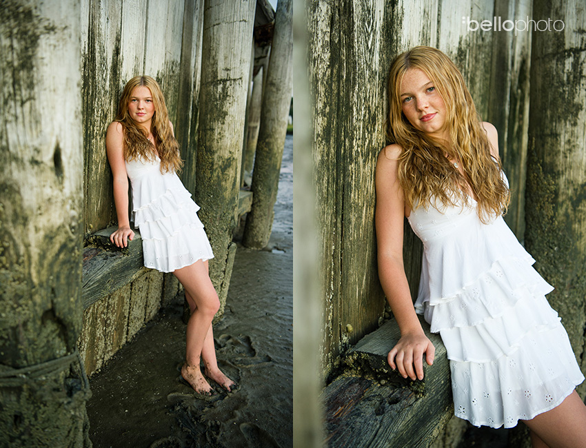 beautiful girl leaning against old beach wall, beautiful girl at sunset standing in beach grass, beautiful girl playing at beach, Cape Cod senior portrait