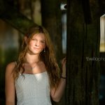 Gorgeous girl in cool light under beach boardwalk
